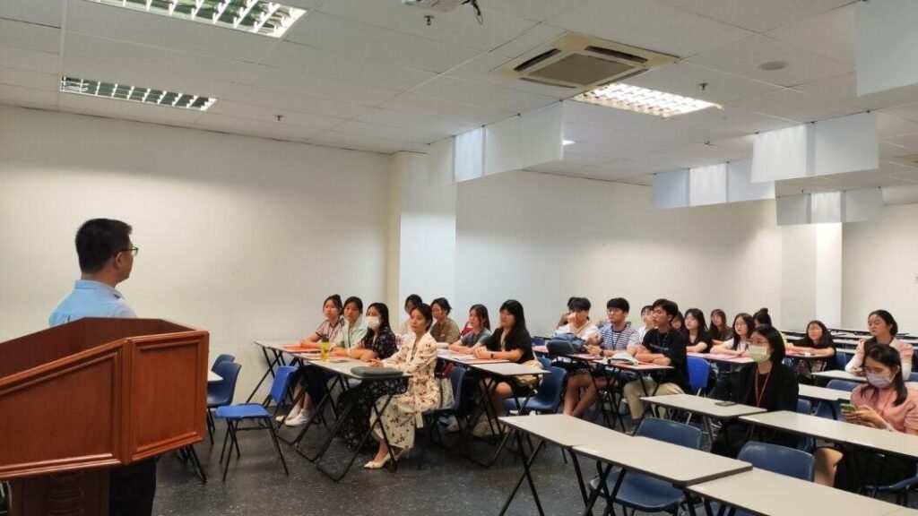 International students attending lecture in Malaysian university classroom with modern learning setup