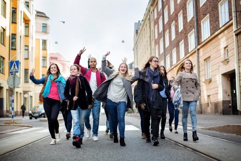 International students studying in a modern Finnish library and experiencing student life