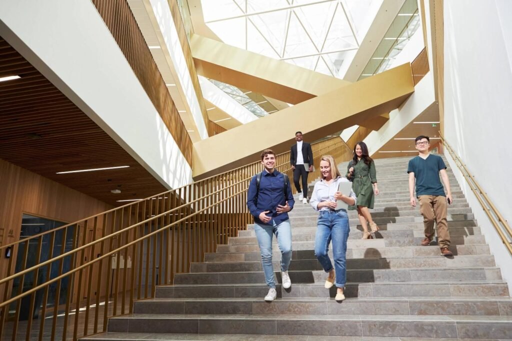International students at a modern Finnish university campus with Nordic architecture