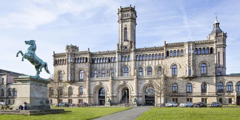 International students at a prestigious German university campus with historic and modern architecture in high resolution
