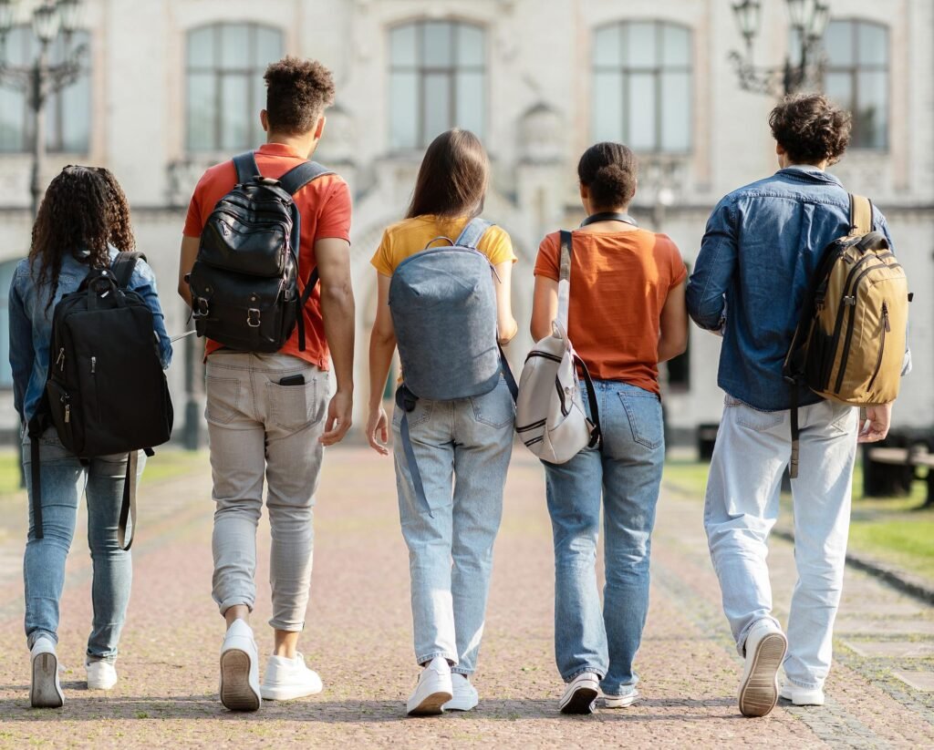 International students walking inside a historic Lithuanian university campus in Vilnius