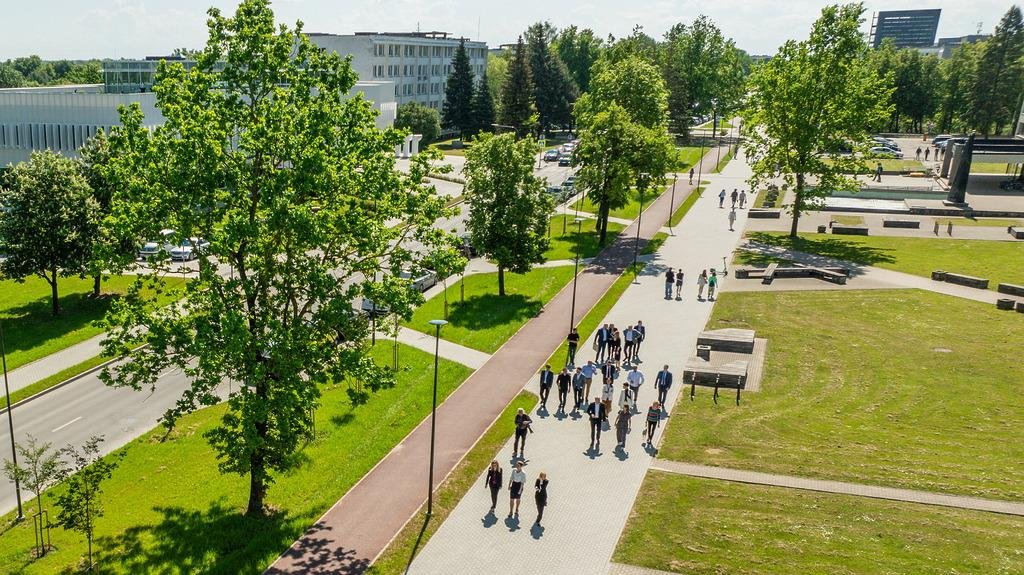 International students walking inside a historic Lithuanian university campus in Vilnius