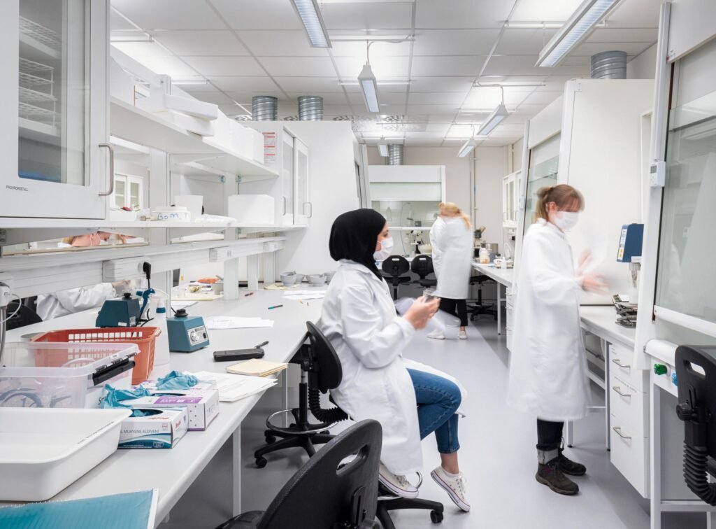 Students working in a modern Swedish university lab with advanced technology and research equipment