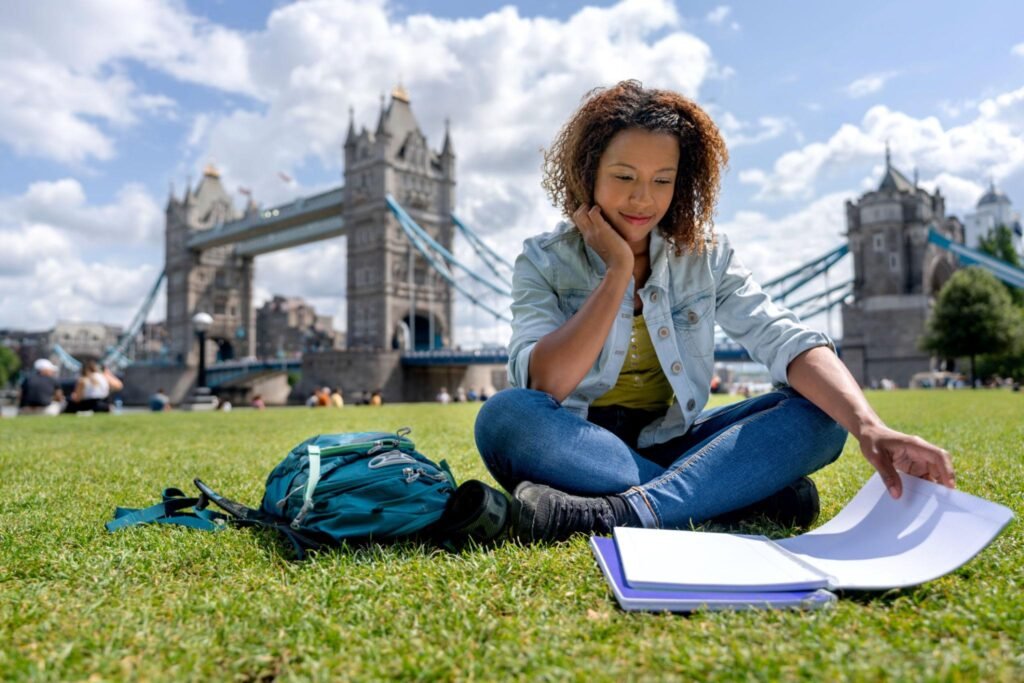 International students Sitting near London landmarks experiencing UK city life and culture